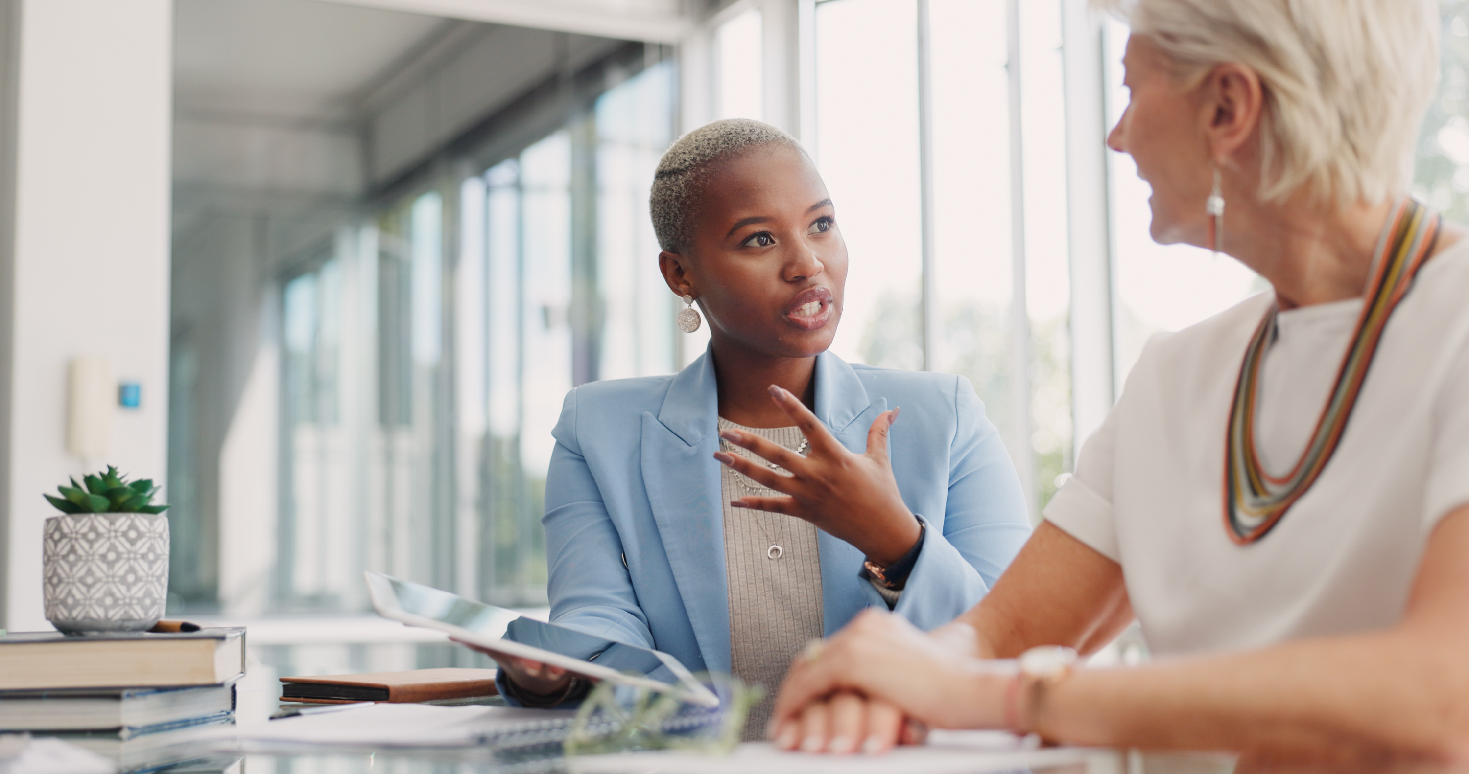 two professional women having a work discussion