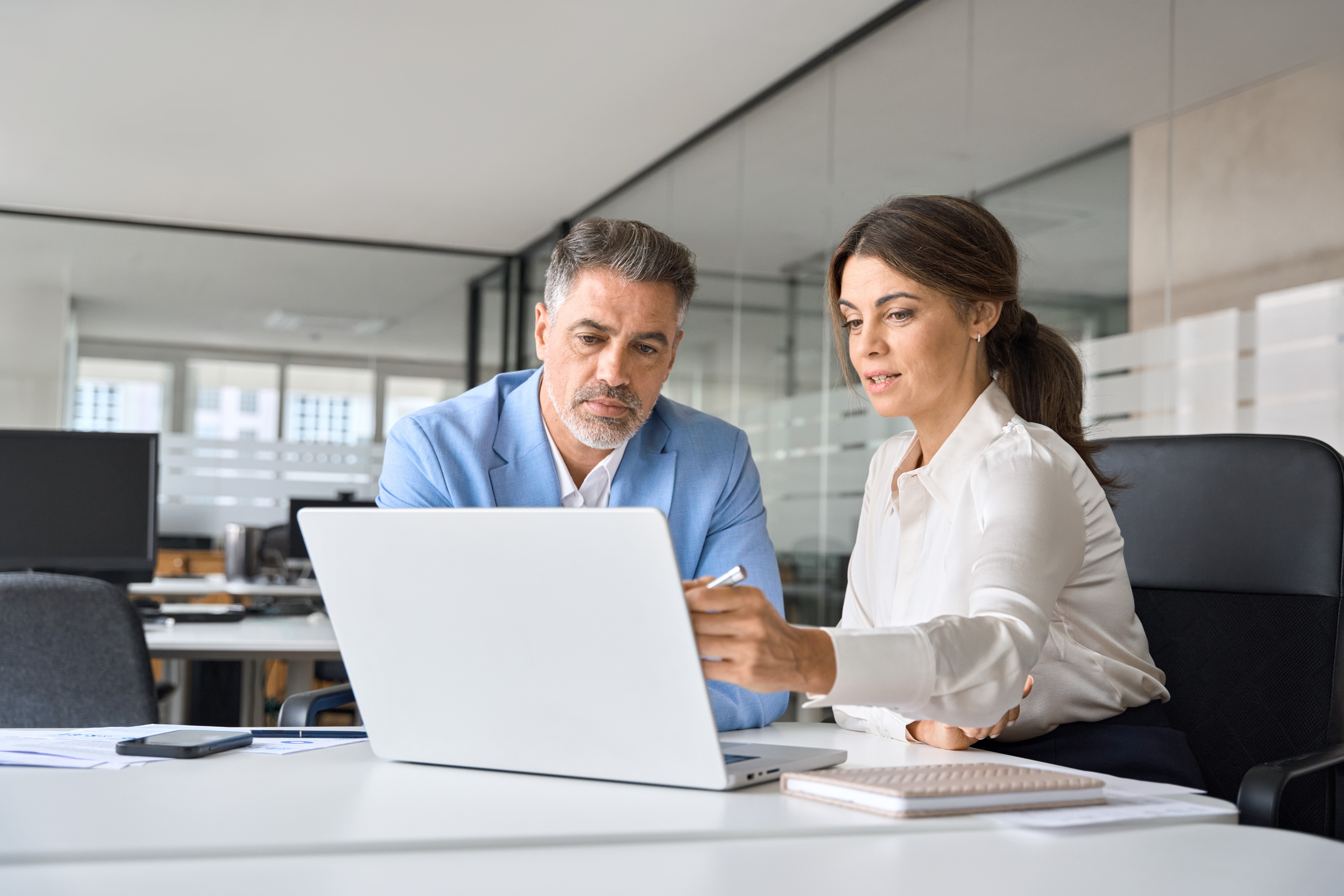 An executive working collaboratively with a colleague