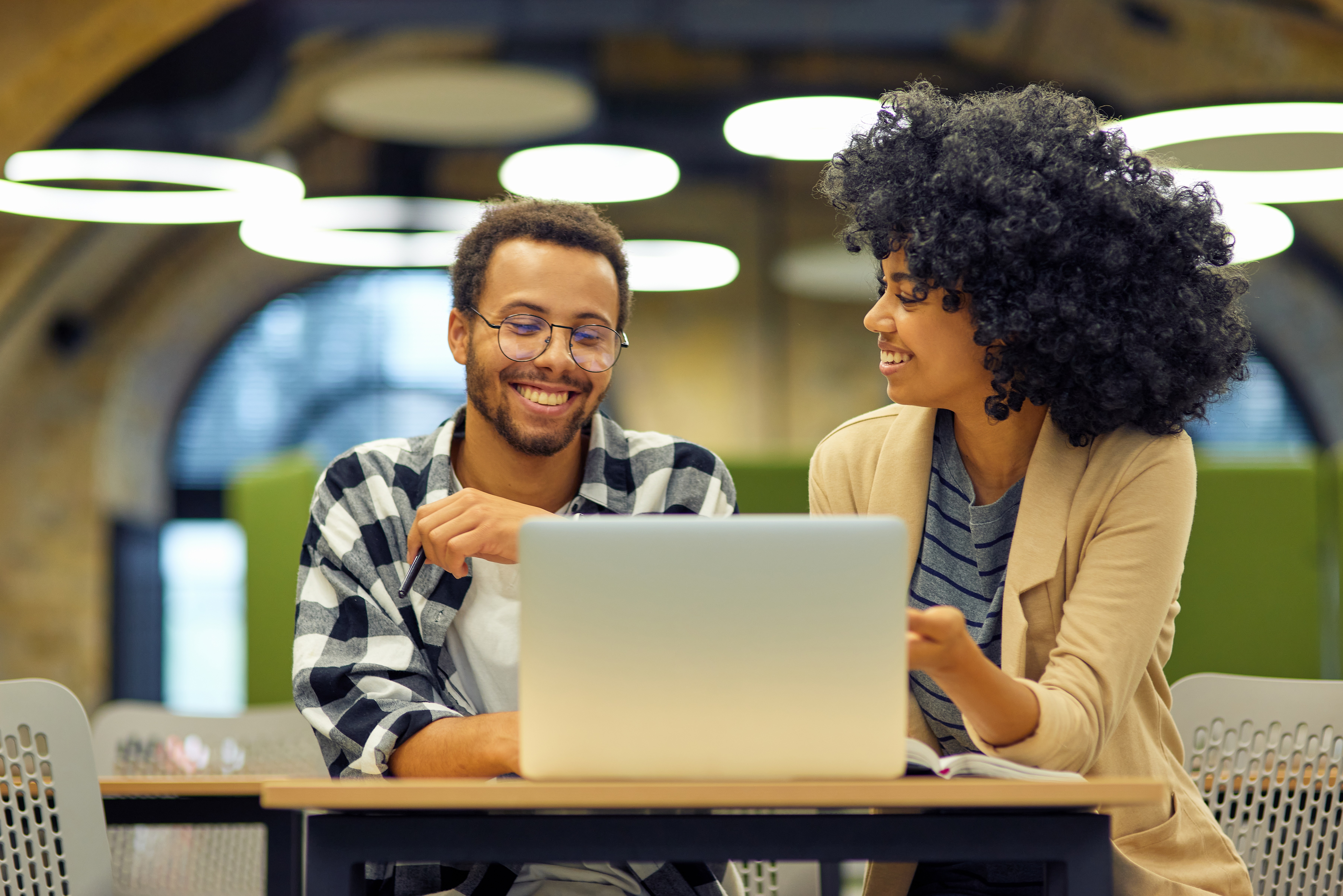 Two people with laptop