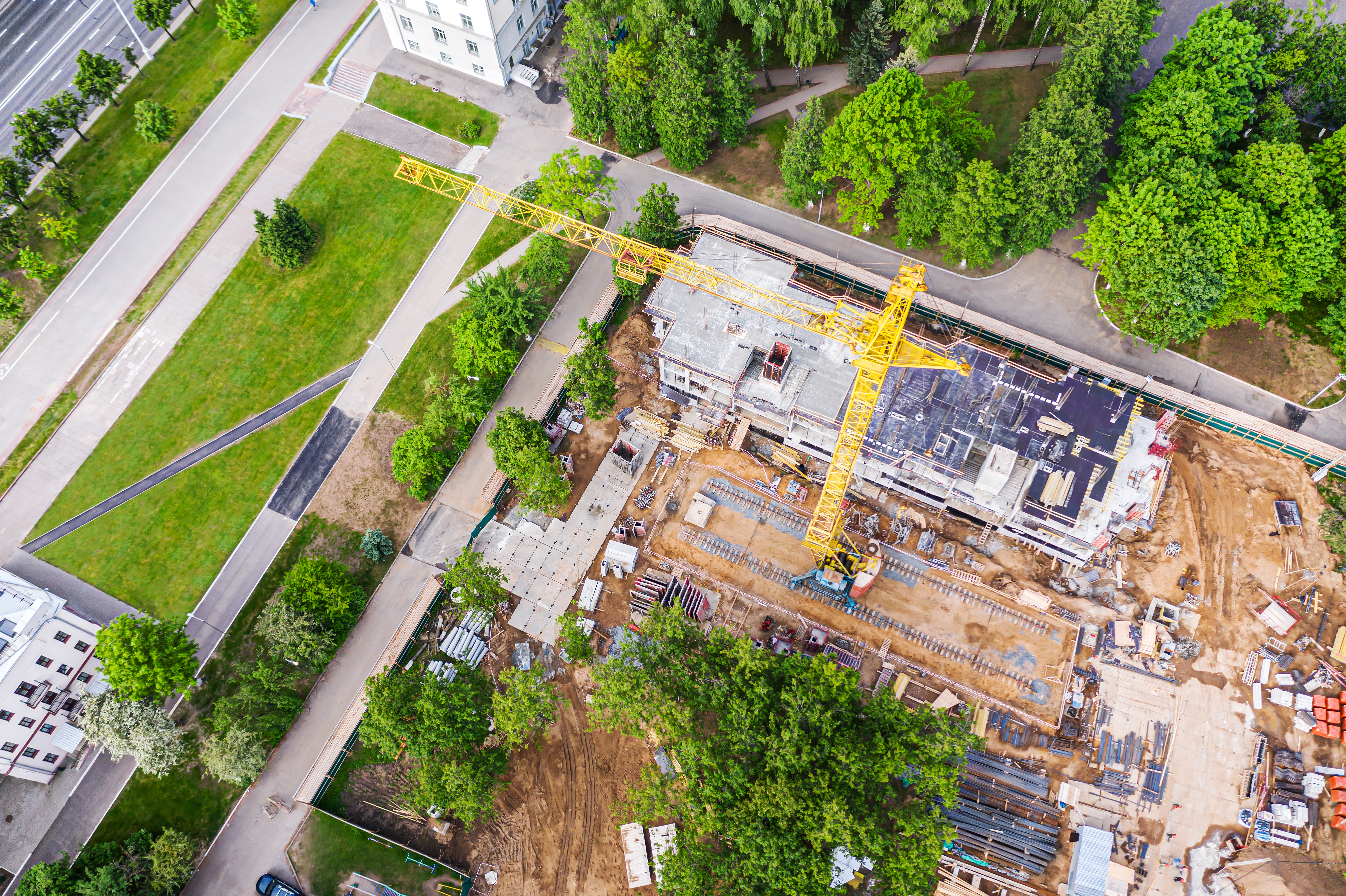 Construction site in a city with greenery