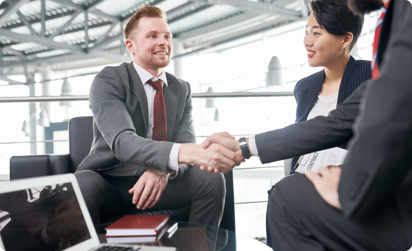 Business people shaking hands after meeting.